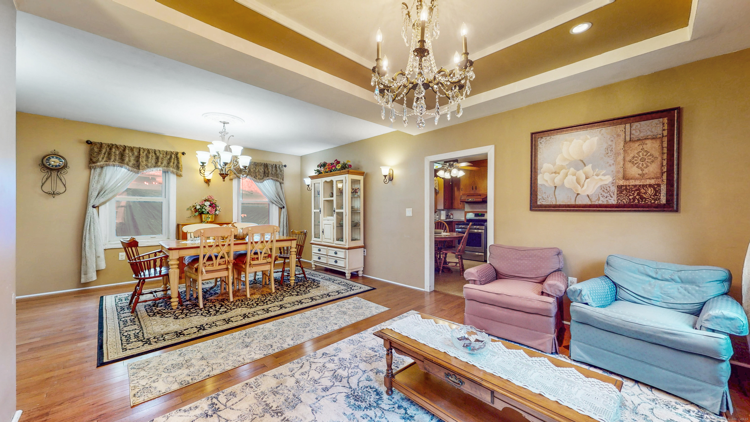 59 Elm Street Windsor Locks, CT 06096 - Photo 9 of 38 a living room with furniture and a chandelier