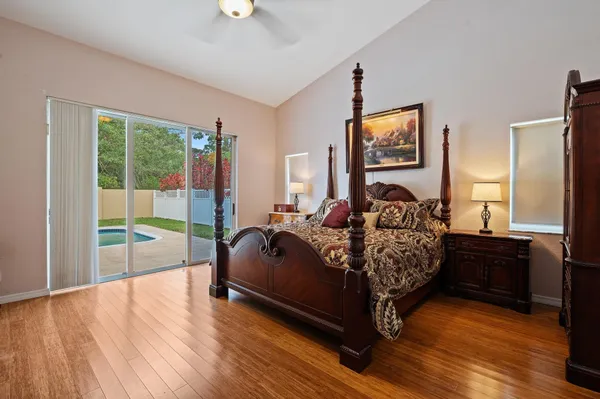 a bed room with a bed and a chair