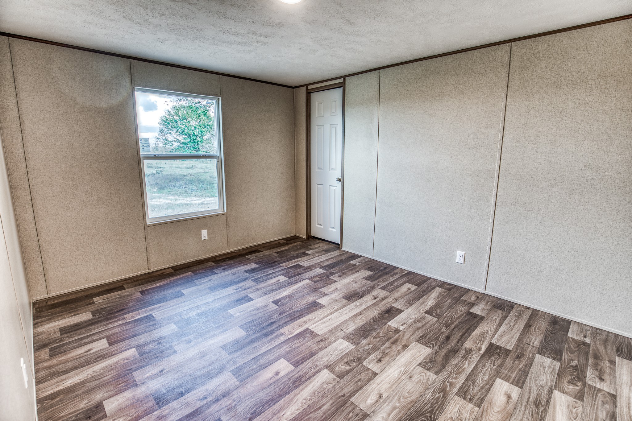 1001 Schmidt Road Waller, TX 77484 - Photo 13 of 28 a view of empty room with window and hardwood floor