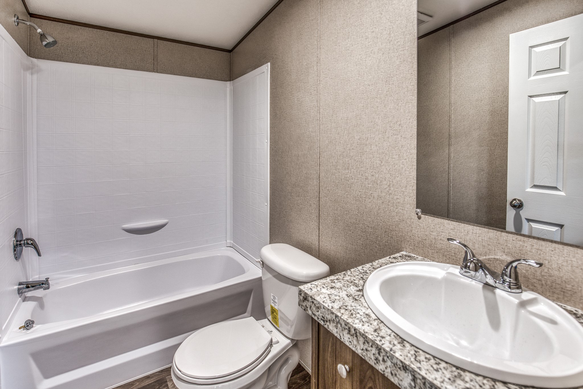 1001 Schmidt Road Waller, TX 77484 - Photo 14 of 28 a bathroom with a granite countertop sink toilet and shower