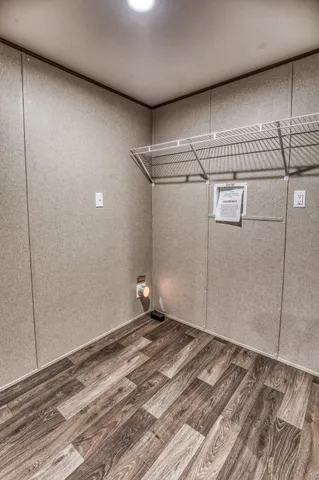 a view of a room with wooden floor