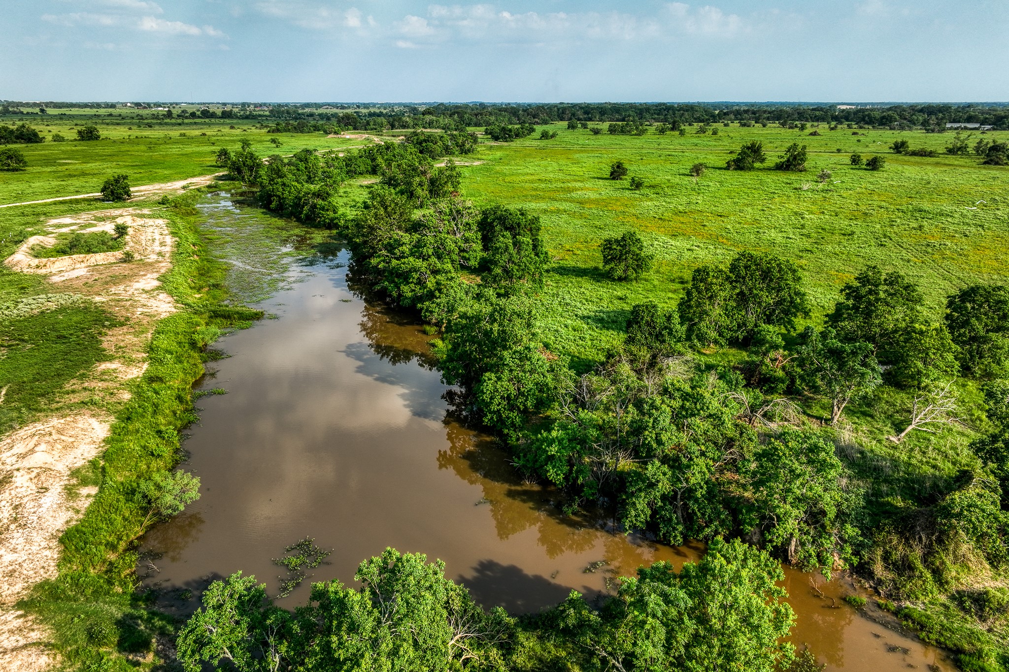 1001 Schmidt Road Waller, TX 77484 - Photo 23 of 28 a view of a lake with a city