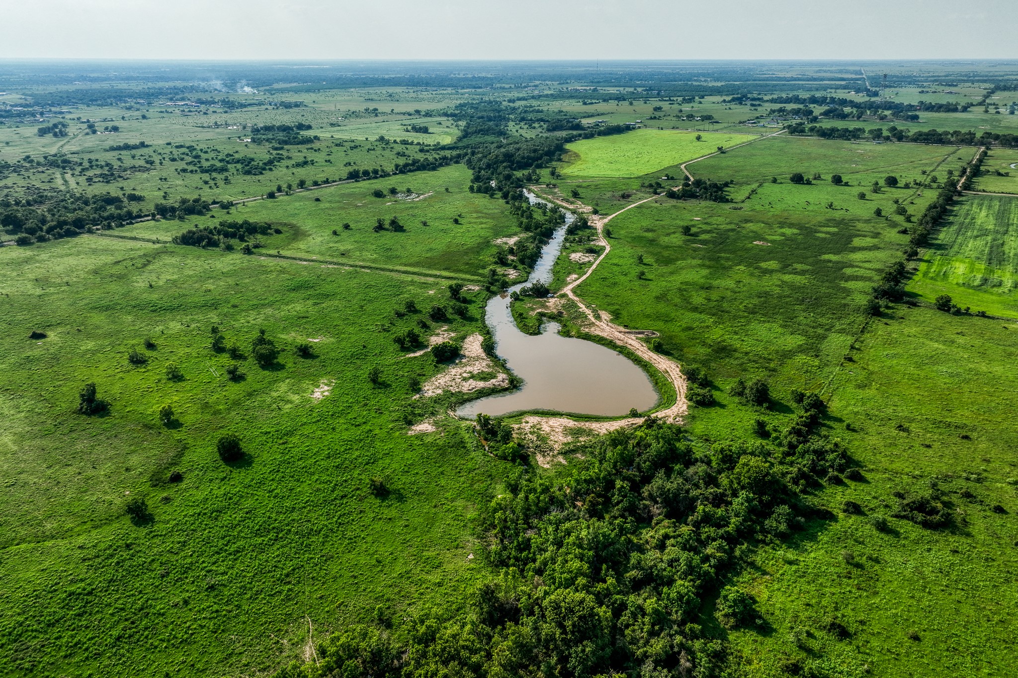 1001 Schmidt Road Waller, TX 77484 - Photo 27 of 28 a view of a lush green field
