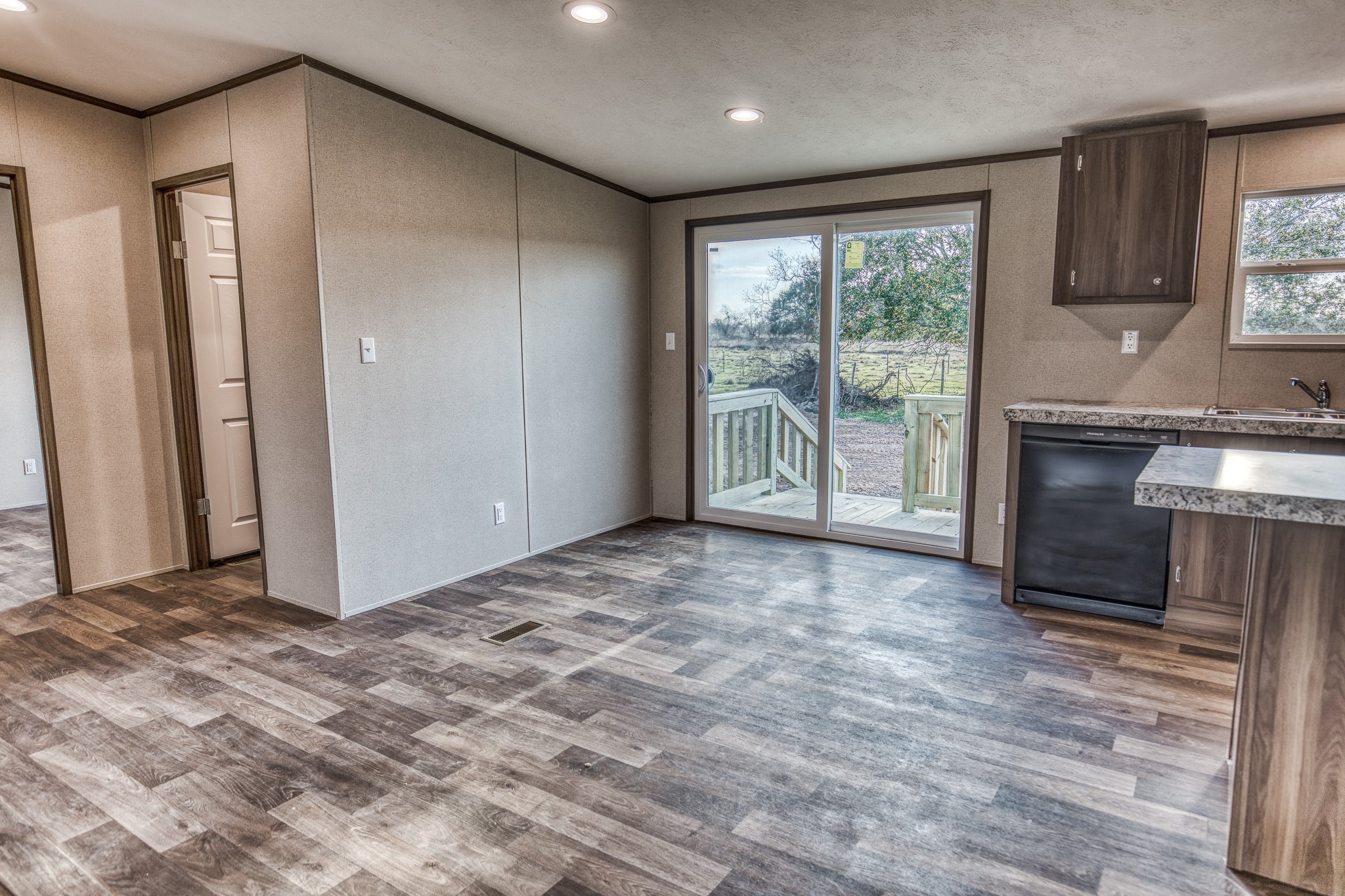 1001 Schmidt Road Waller, TX 77484 - Photo 9 of 28 a view of a kitchen with a sink and a fireplace