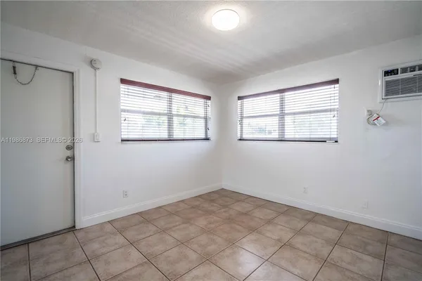 a view of empty room with windows
