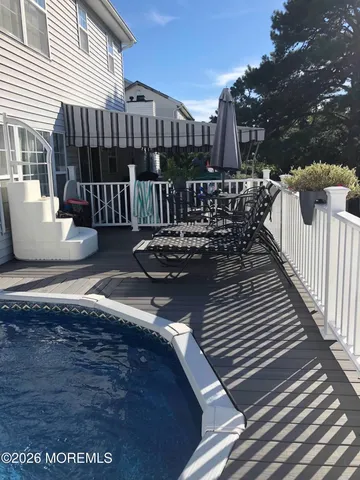 a view of a balcony with wooden floor