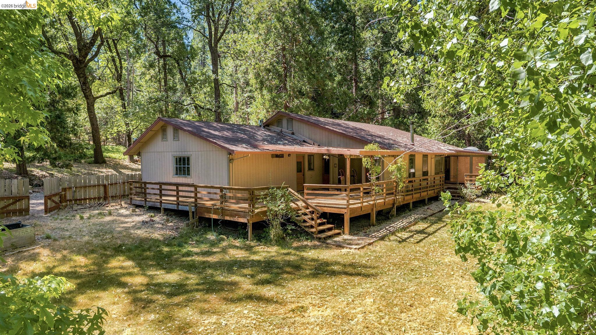 22401 South Fork Road Sonora, CA 95370 - Photo 32 of 34 Ranch-style residence featuring an extensive wood deck and a covered porch
