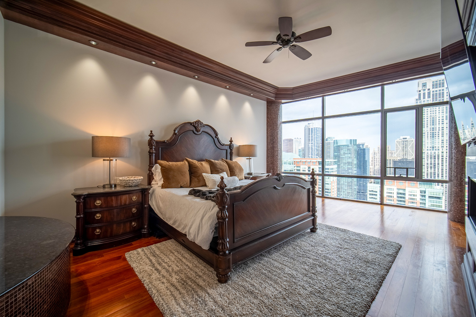 450 East Waterside Drive, Unit 3301 Chicago, IL 60601 - Photo 13 of 44 a living room with a bed furniture and a large window