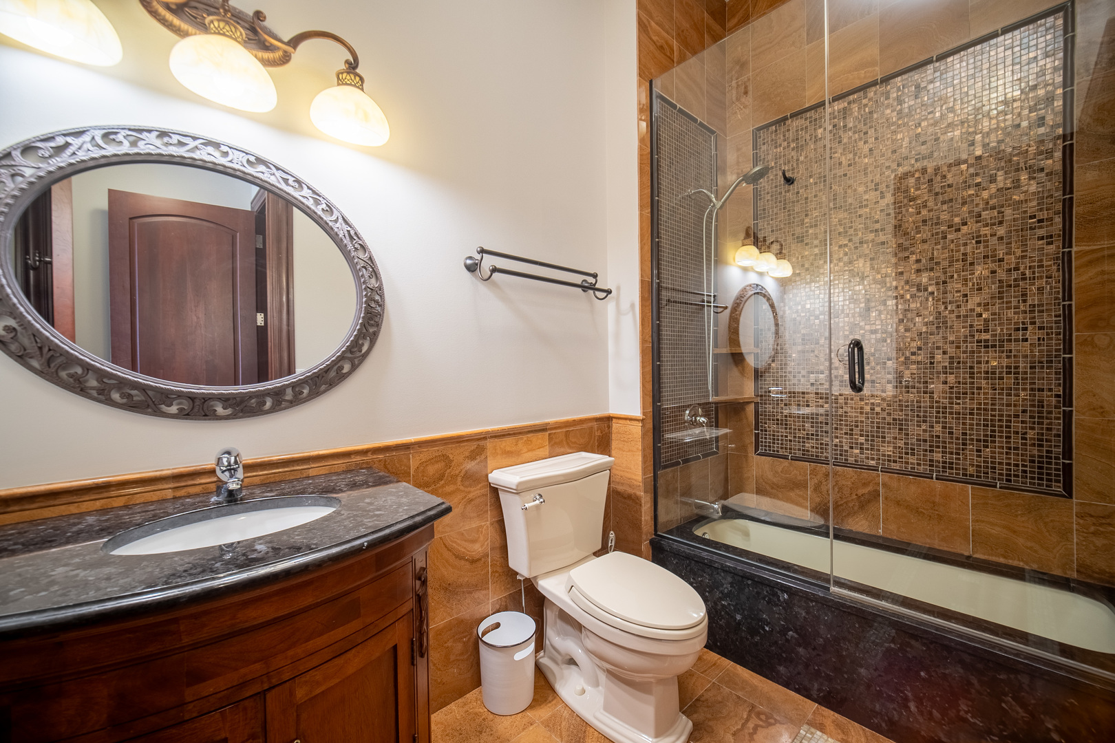 450 East Waterside Drive, Unit 3301 Chicago, IL 60601 - Photo 23 of 44 a bathroom with a toilet a sink and mirror