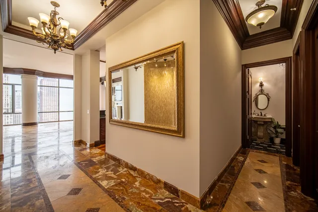 a bathroom with a sink mirror and toilet