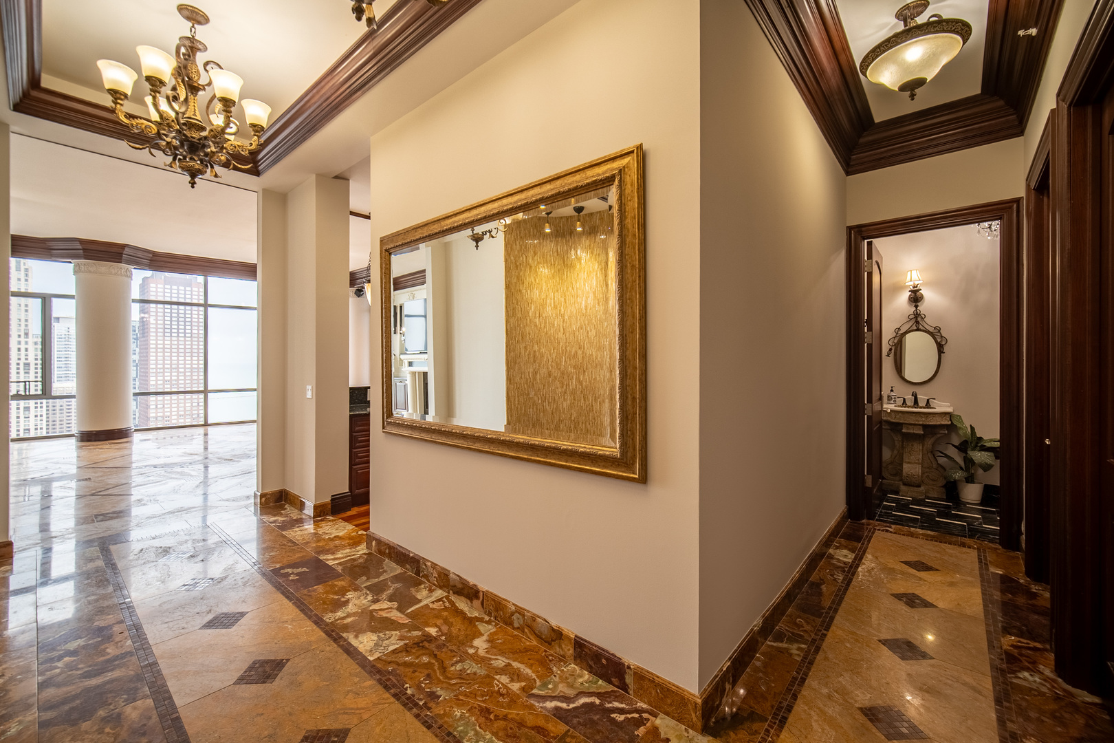450 East Waterside Drive, Unit 3301 Chicago, IL 60601 - Photo 24 of 44 a view of a hallway with wooden floor and a chandelier