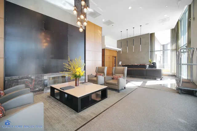 a view of a porch with furniture and wooden floors
