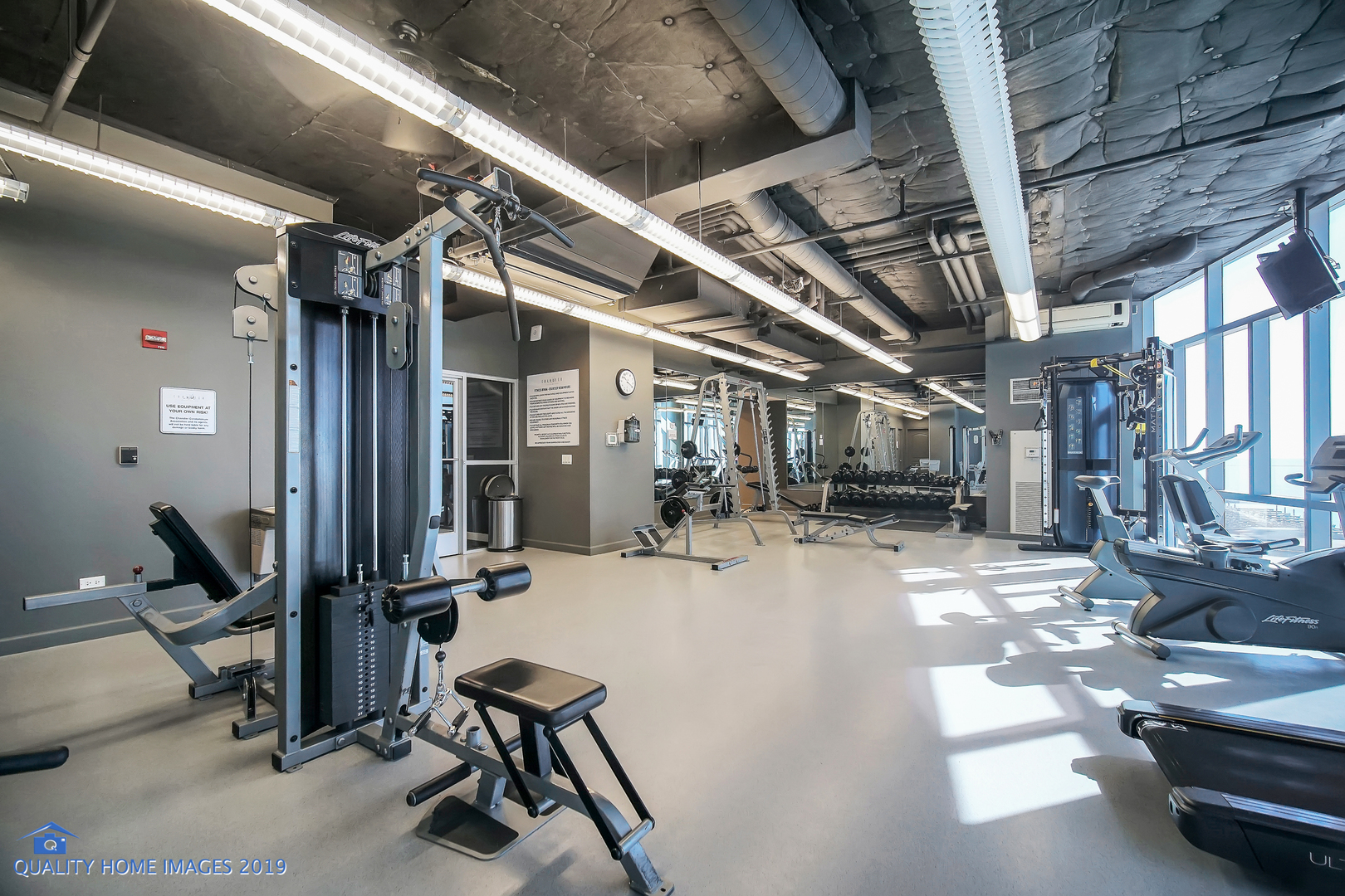 450 East Waterside Drive, Unit 3301 Chicago, IL 60601 - Photo 29 of 44 a view of a room with gym equipment