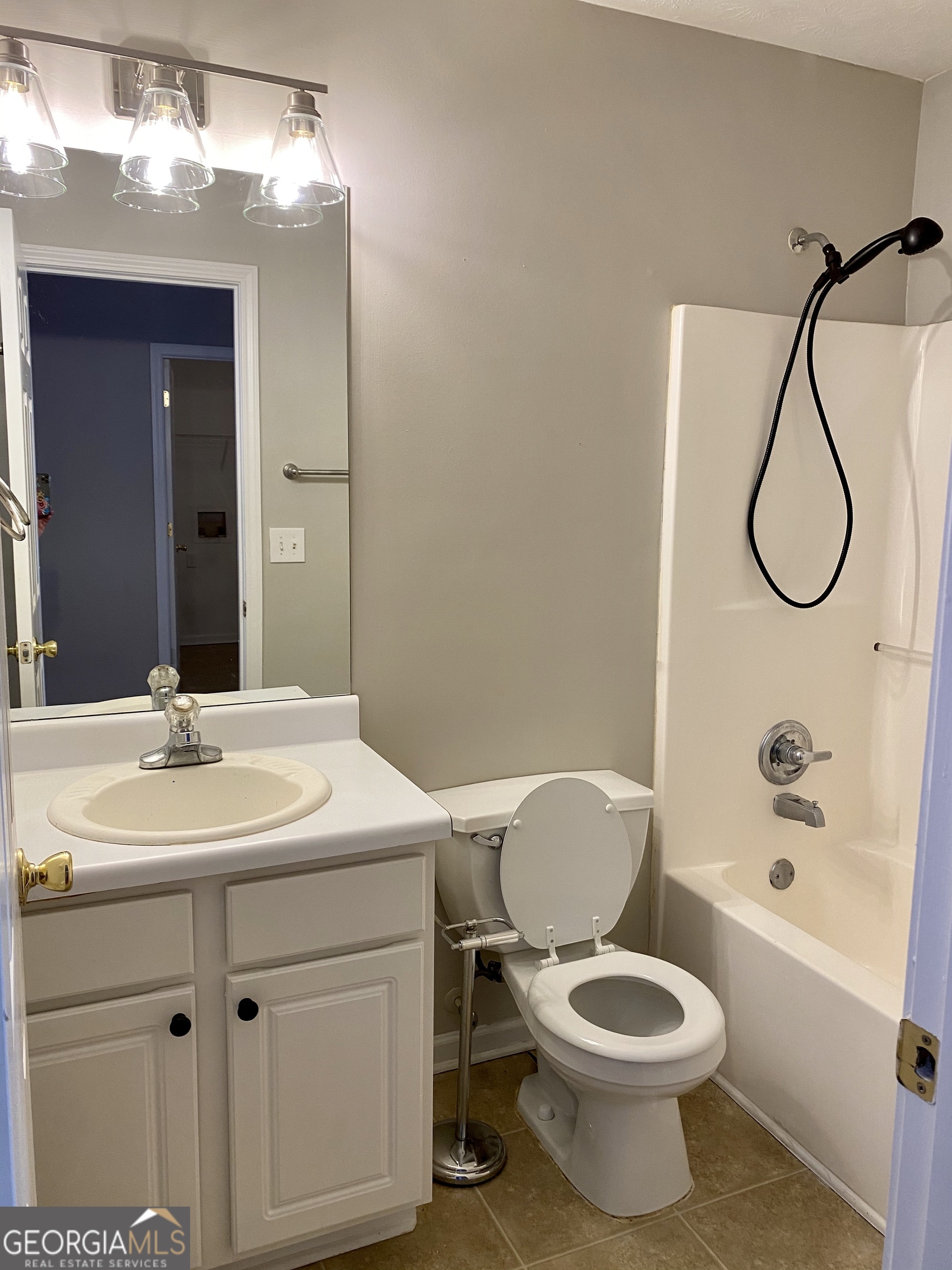 3624 White Sands Way Suwanee, GA 30024 - Photo 14 of 19 a bathroom with a toilet sink vanity shower and mirror