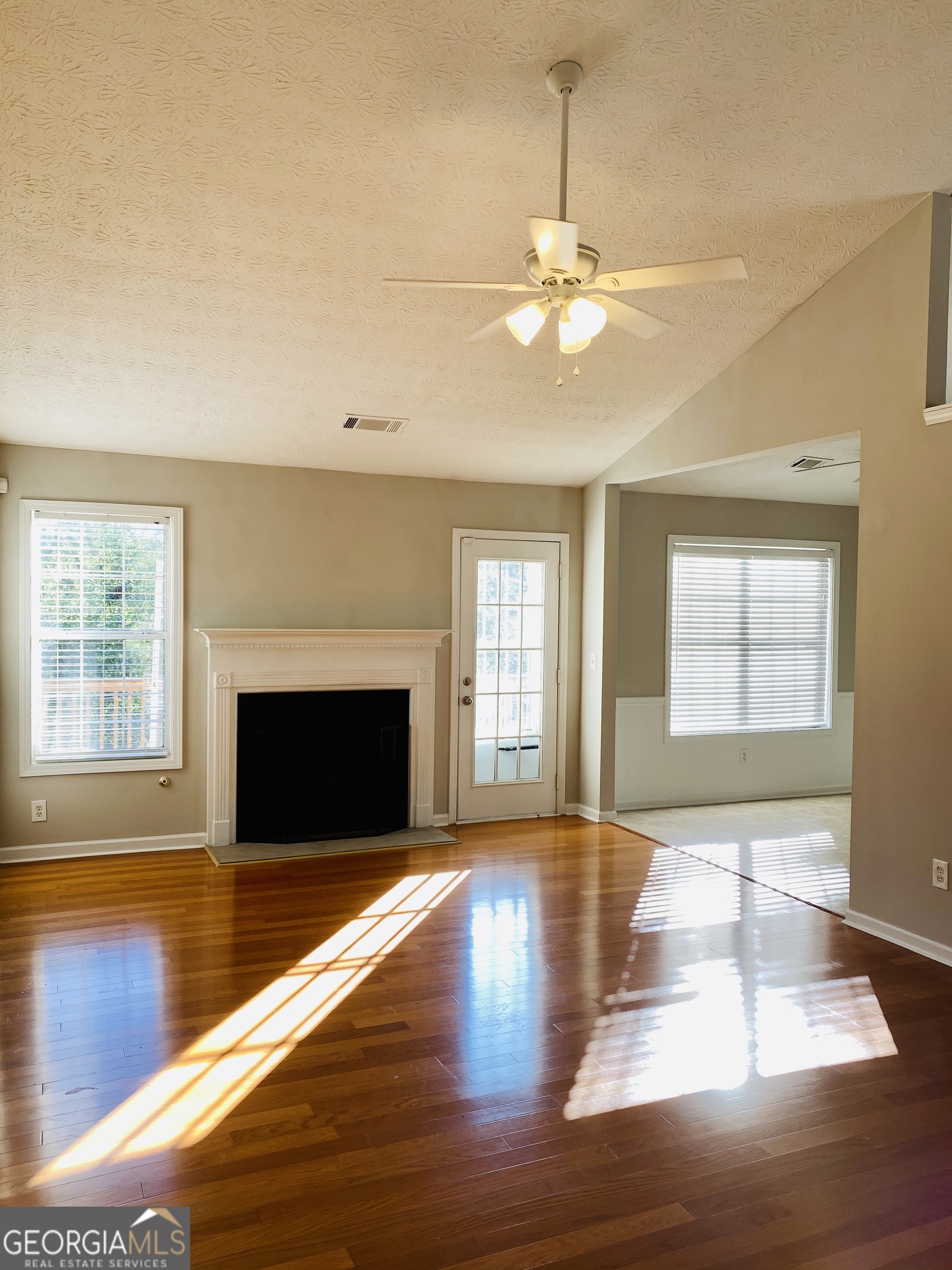 3624 White Sands Way Suwanee, GA 30024 - Photo 3 of 19 a view of empty room with wooden floor and fan