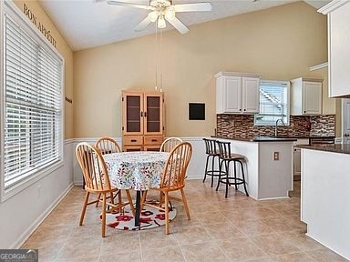 3624 White Sands Way Suwanee, GA 30024 - Photo 7 of 19 a dining room with furniture and chandelier