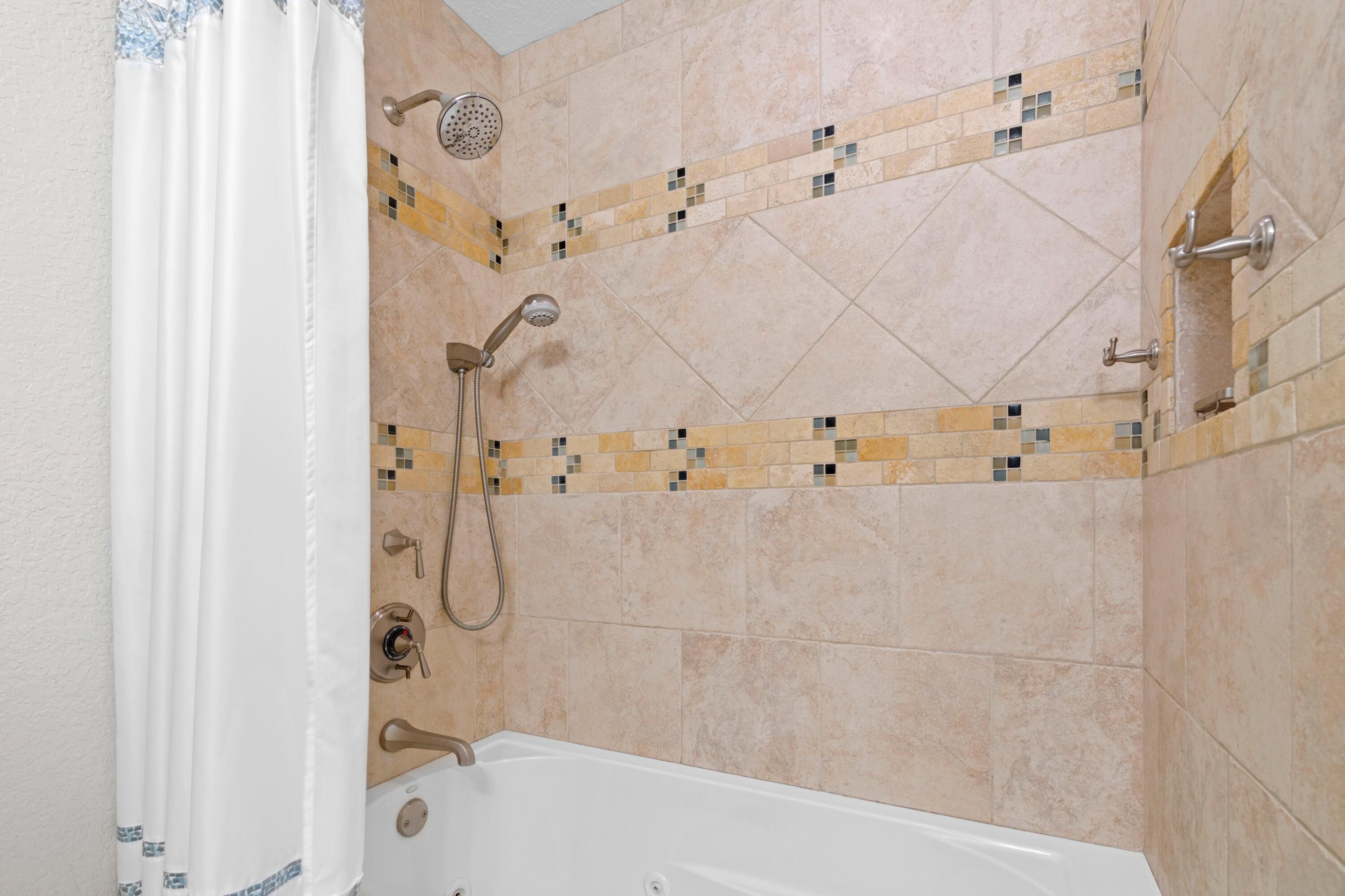 263 Northeast 24th Court Boca Raton, FL 33431 - Photo 12 of 29 a bathroom with a bathtub with shower