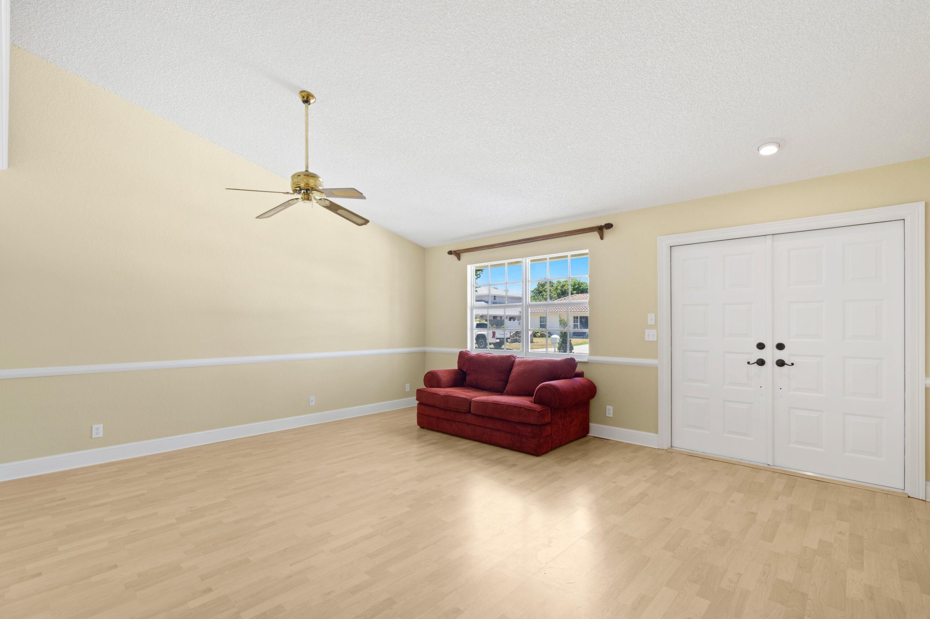 263 Northeast 24th Court Boca Raton, FL 33431 - Photo 6 of 29 a living room with furniture