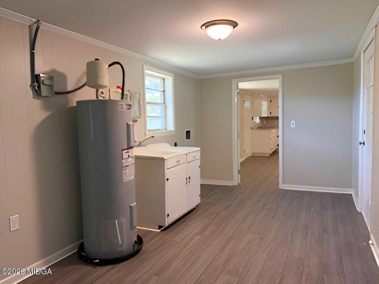 868 Mac Thompson Road Cochran, GA 31014 - Photo 12 of 31 a view of a storage & utility room with two washing machine