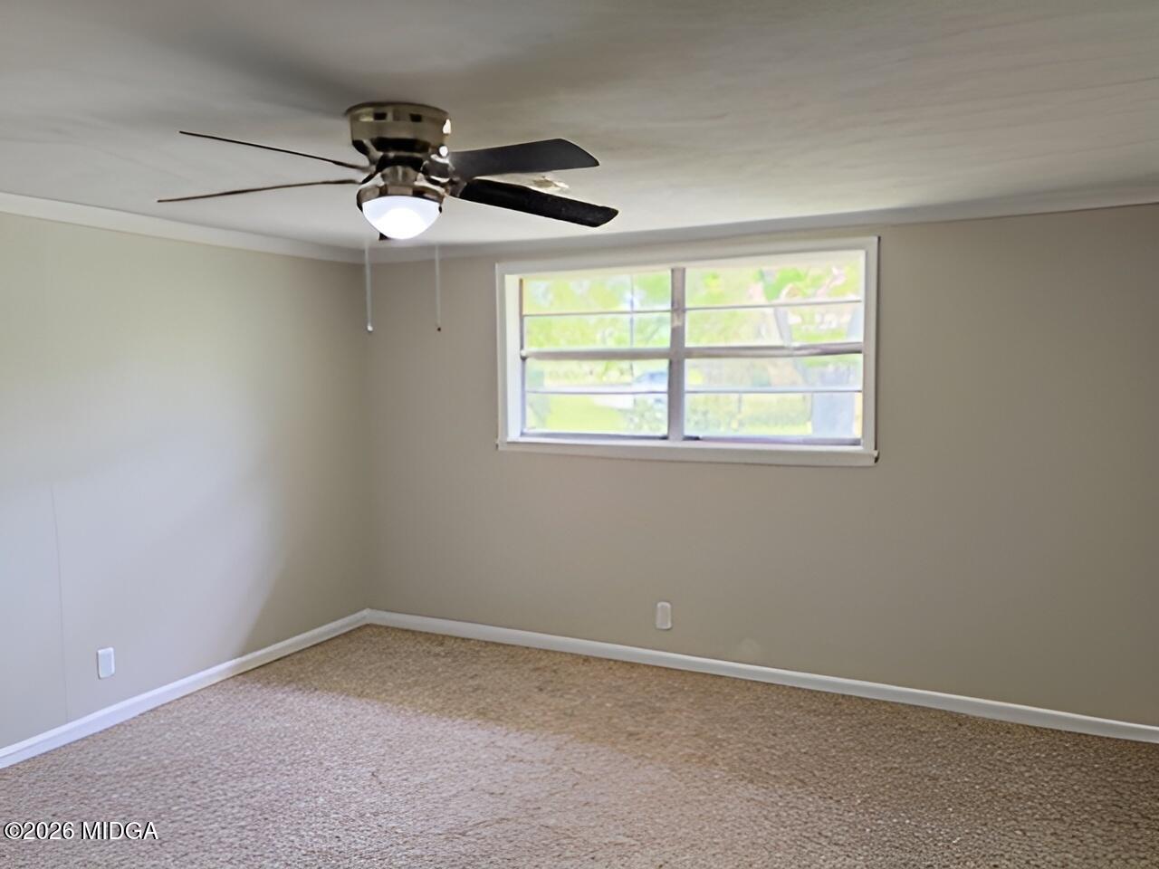 868 Mac Thompson Road Cochran, GA 31014 - Photo 16 of 31 an empty room with a window
