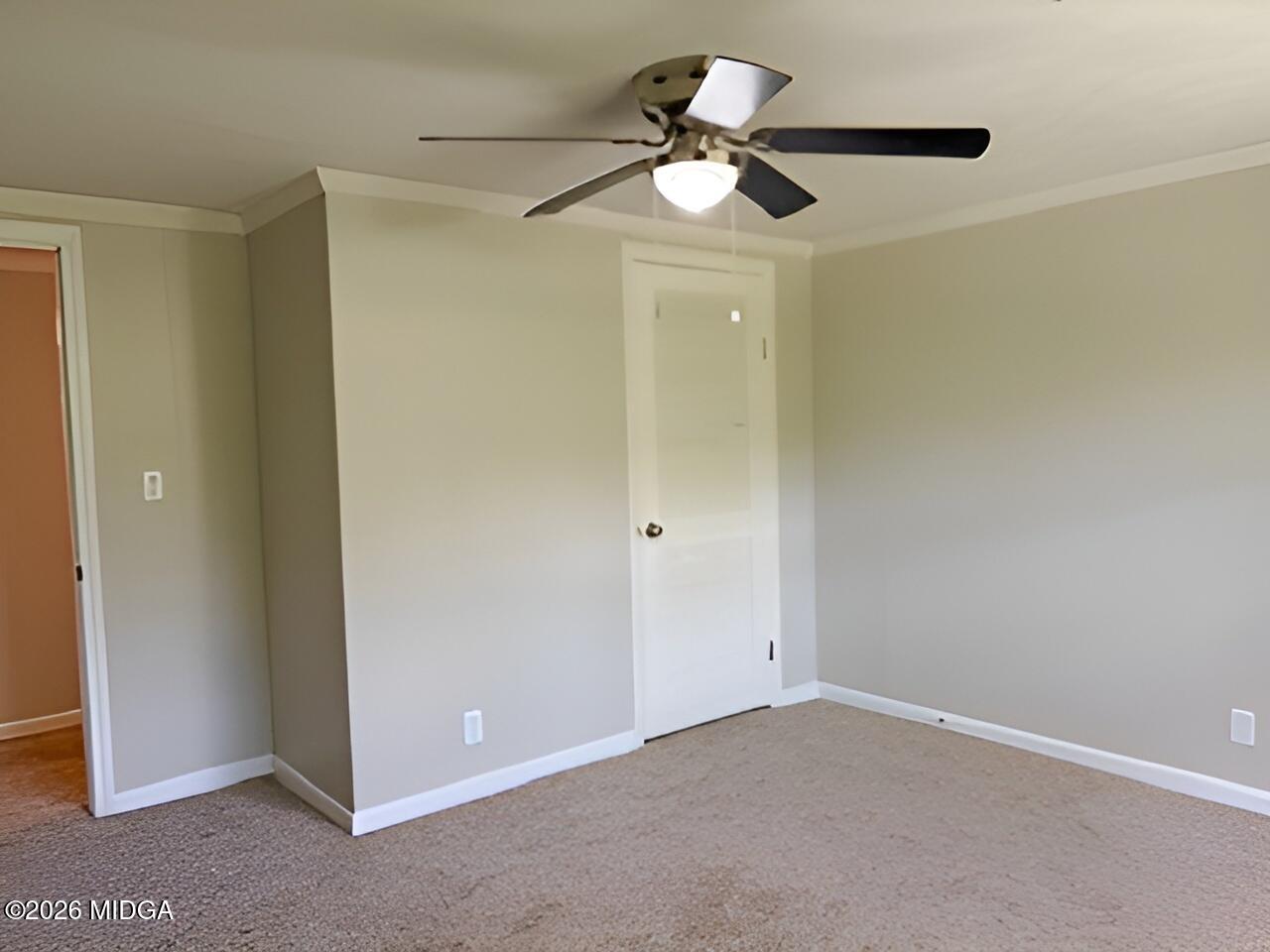 868 Mac Thompson Road Cochran, GA 31014 - Photo 17 of 31 a view of an empty room and chandelier fan
