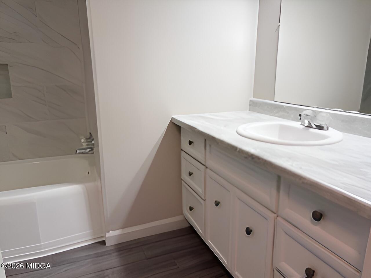 868 Mac Thompson Road Cochran, GA 31014 - Photo 18 of 31 a bathroom with a sink and a mirror