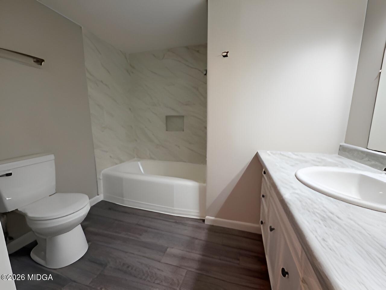 868 Mac Thompson Road Cochran, GA 31014 - Photo 19 of 31 a bathroom with a sink and a toilet