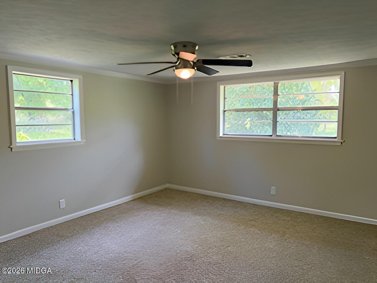 868 Mac Thompson Road Cochran, GA 31014 - Photo 20 of 31 an empty room with a window