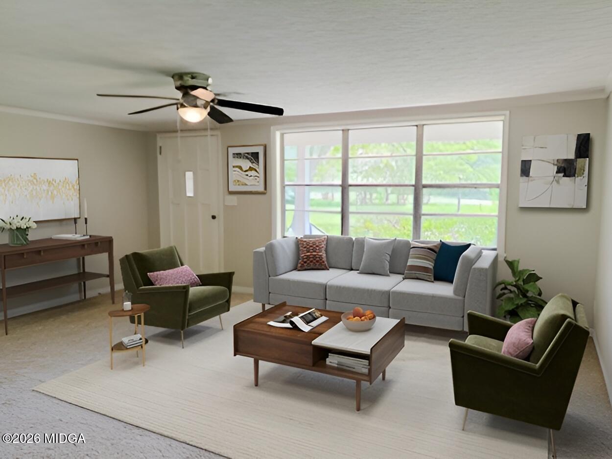 868 Mac Thompson Road Cochran, GA 31014 - Photo 2 of 31 a living room with furniture and a large window