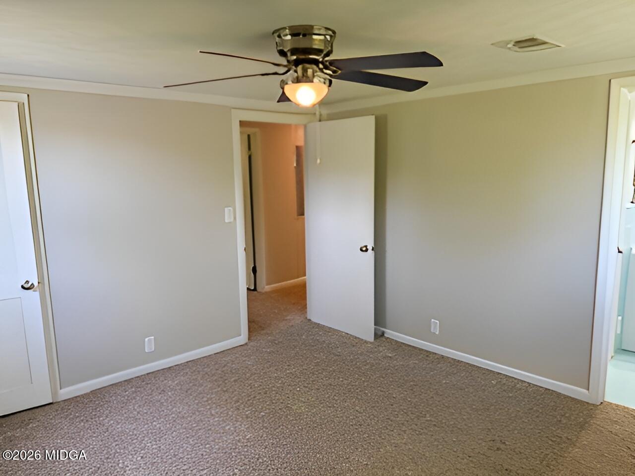 868 Mac Thompson Road Cochran, GA 31014 - Photo 24 of 31 a view of a chandelier fan in a room