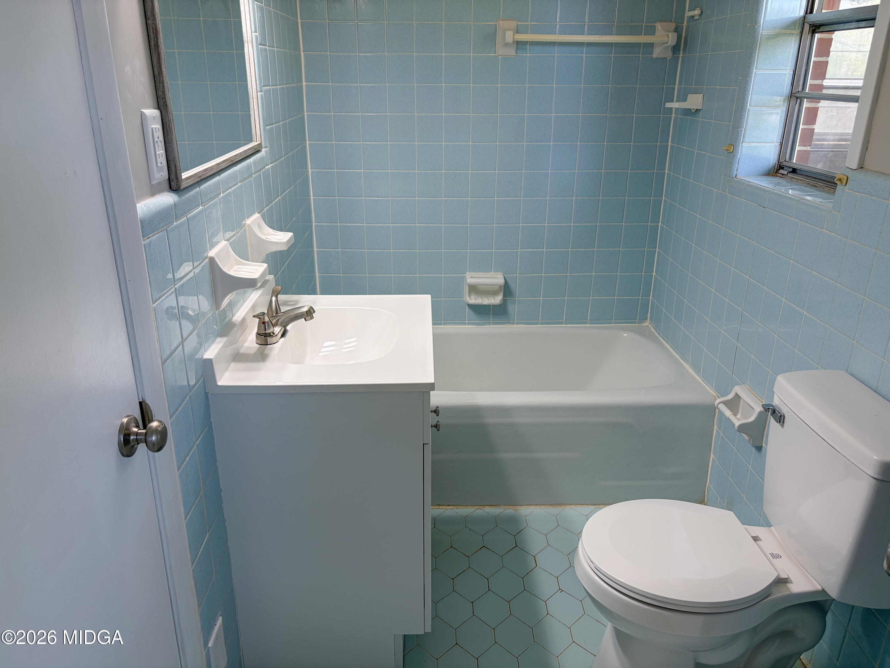 868 Mac Thompson Road Cochran, GA 31014 - Photo 25 of 31 a bathroom with a sink a toilet and shower