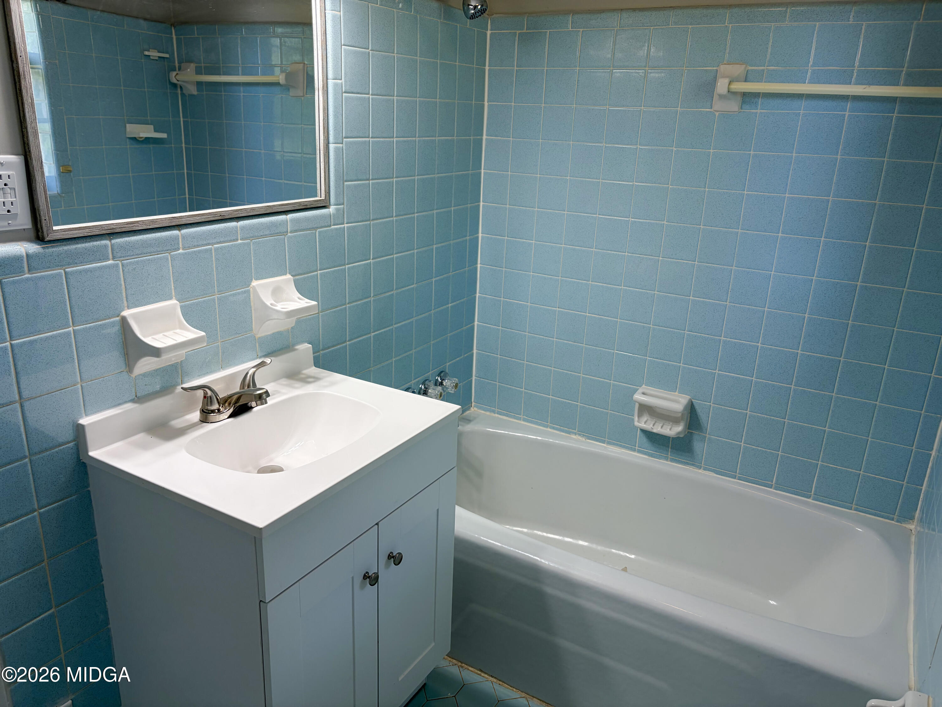 868 Mac Thompson Road Cochran, GA 31014 - Photo 26 of 31 a bathroom with a sink and mirror
