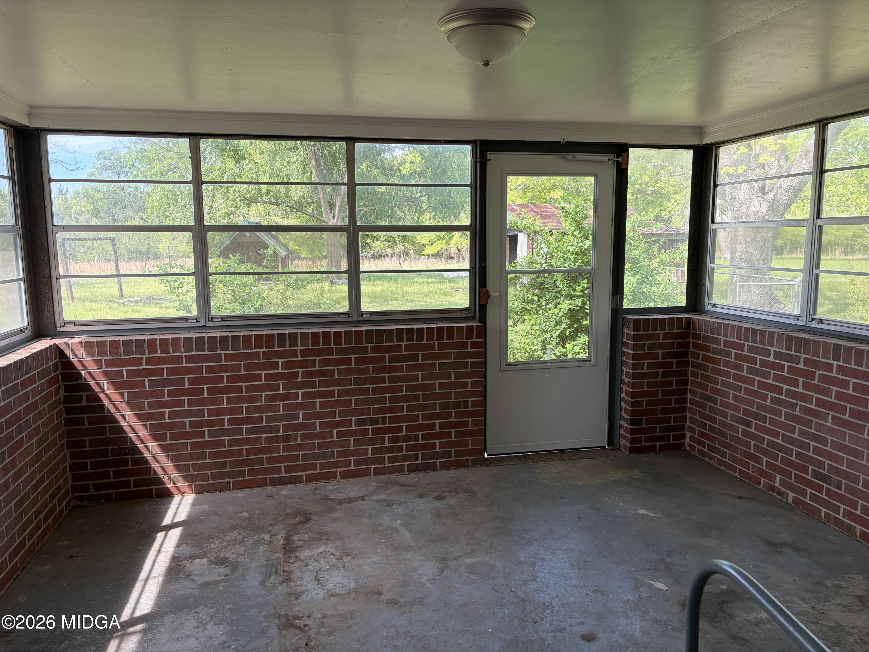868 Mac Thompson Road Cochran, GA 31014 - Photo 28 of 31 a view of an empty room with a window