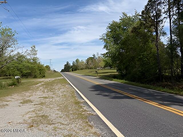 868 Mac Thompson Road Cochran, GA 31014 - Photo 29 of 31 a view of a street with a yard