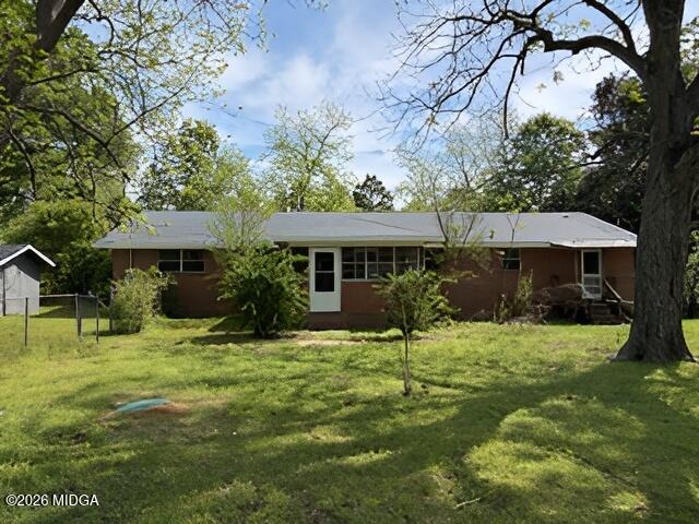 868 Mac Thompson Road Cochran, GA 31014 - Photo 30 of 31 a front view of a house with a yard