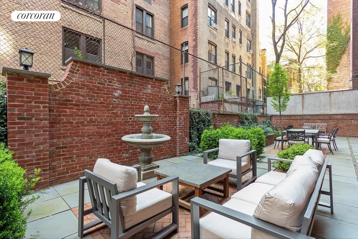 18 West 70th Street, Unit 8C Manhattan, NY 10023 - Photo 16 of 26 a view of a patio with a table and chairs