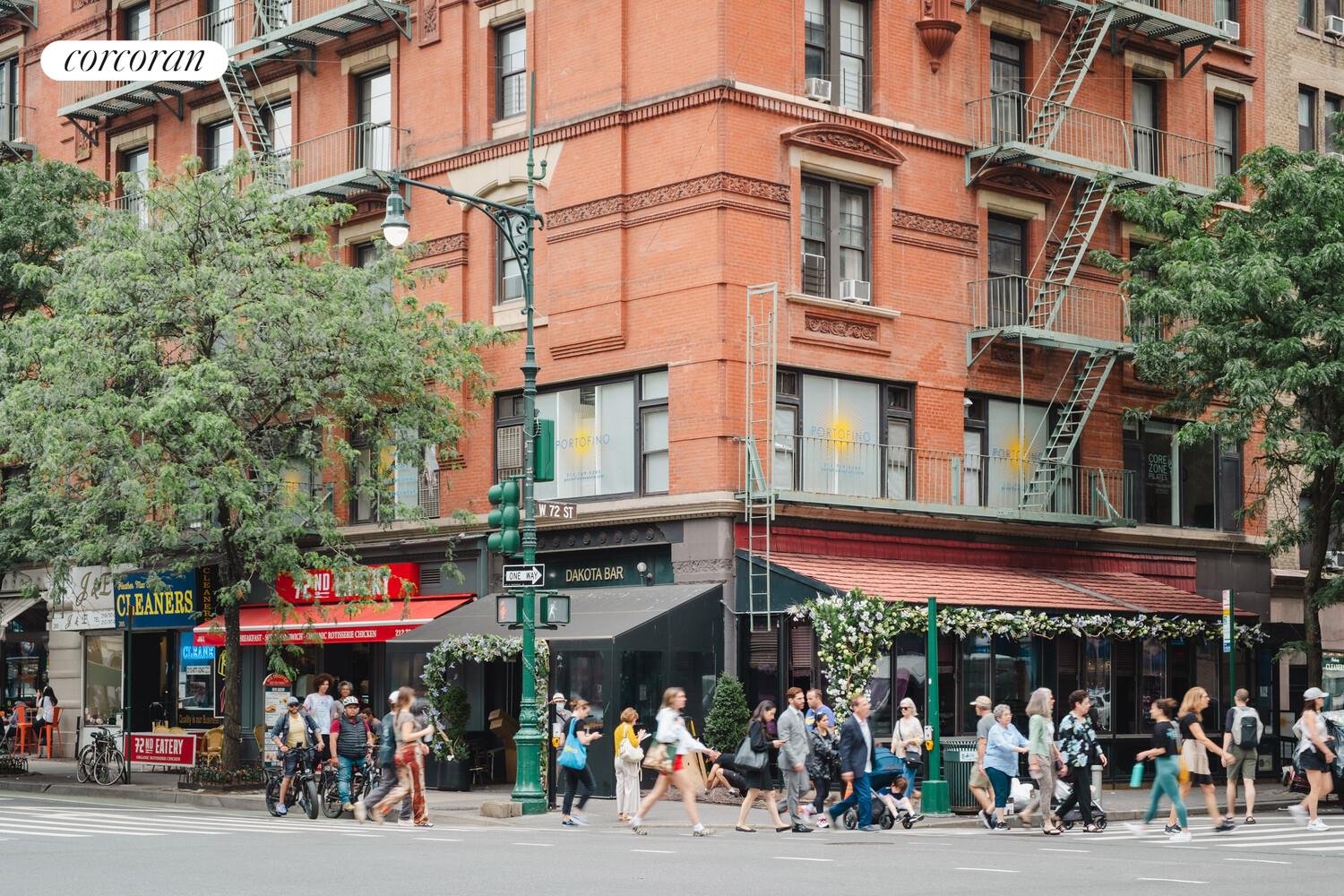 18 West 70th Street, Unit 8C Manhattan, NY 10023 - Photo 18 of 26 a group of people sitting in front of a store