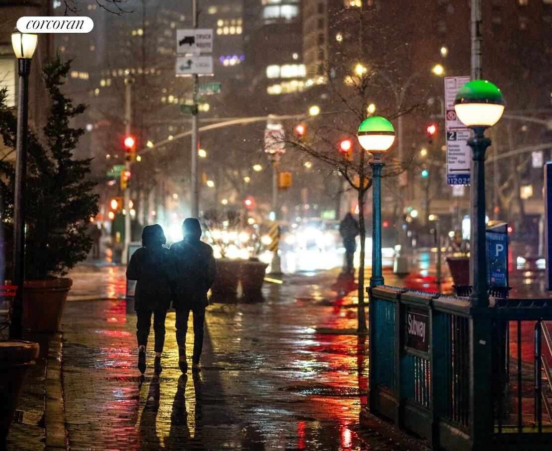 18 West 70th Street, Unit 8C Manhattan, NY 10023 - Photo 22 of 26 a view of a fountain with umbrellas in front of building