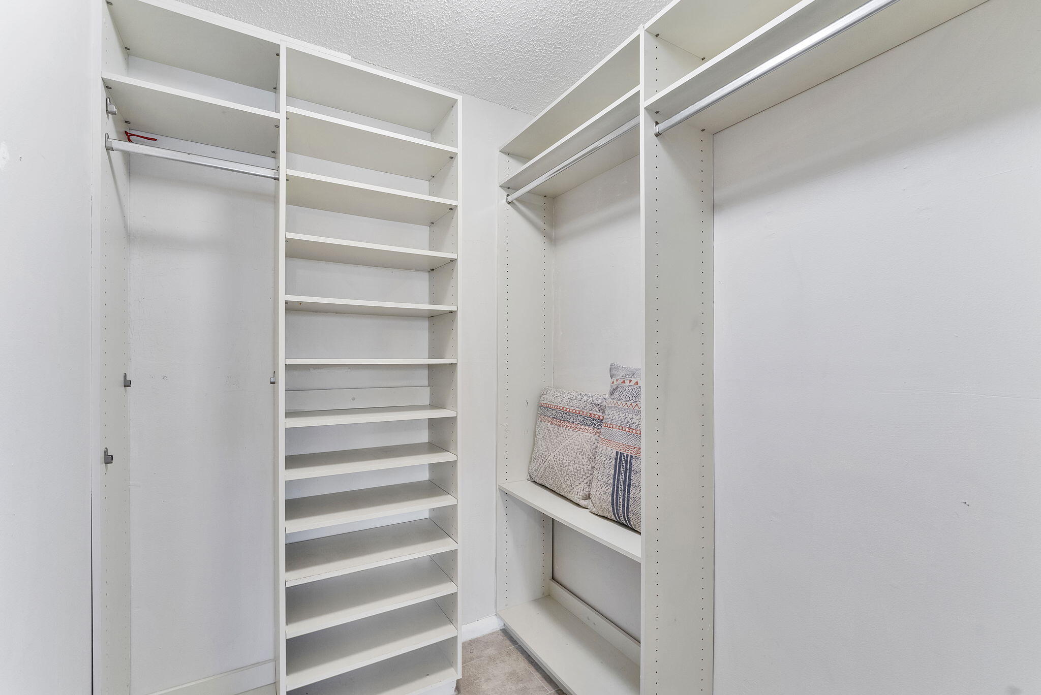 3200 Northeast 10th Street, Unit 7 Pompano Beach, FL 33062 - Photo 18 of 27 a view of walk in closet with empty racks