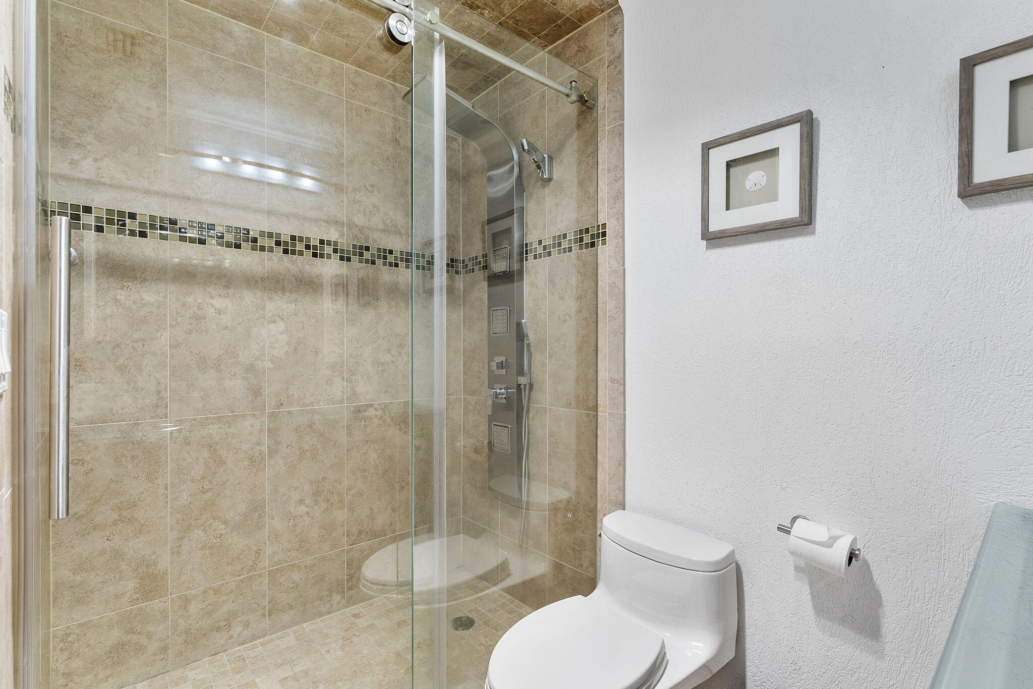 3200 Northeast 10th Street, Unit 7 Pompano Beach, FL 33062 - Photo 20 of 27 a bathroom with a toilet sink and shower