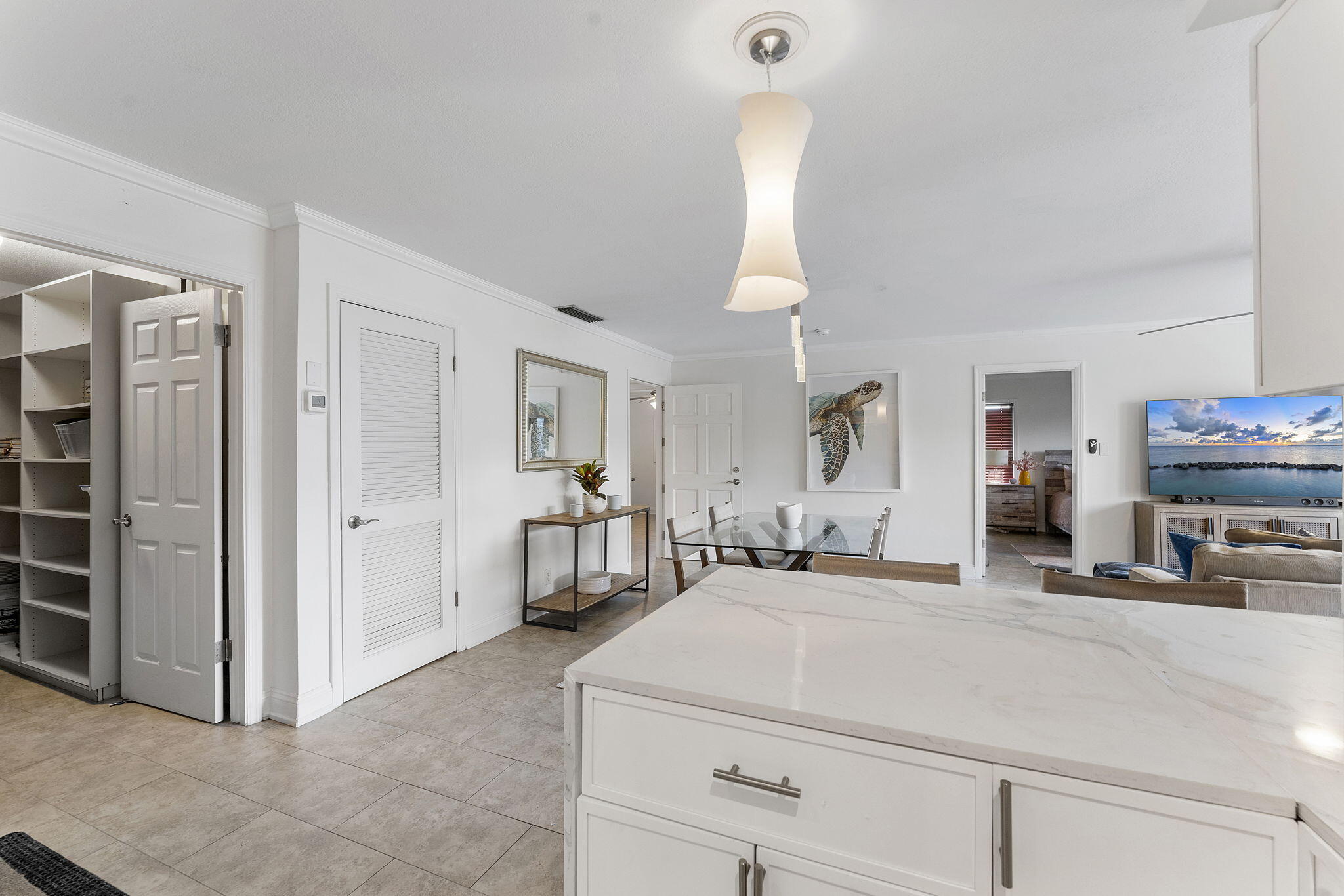 3200 Northeast 10th Street, Unit 7 Pompano Beach, FL 33062 - Photo 22 of 27 a room with a bed and a mirror