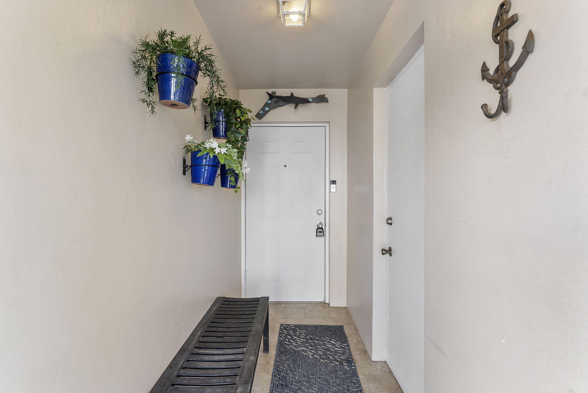 3200 Northeast 10th Street, Unit 7 Pompano Beach, FL 33062 - Photo 23 of 27 a view of a hallway