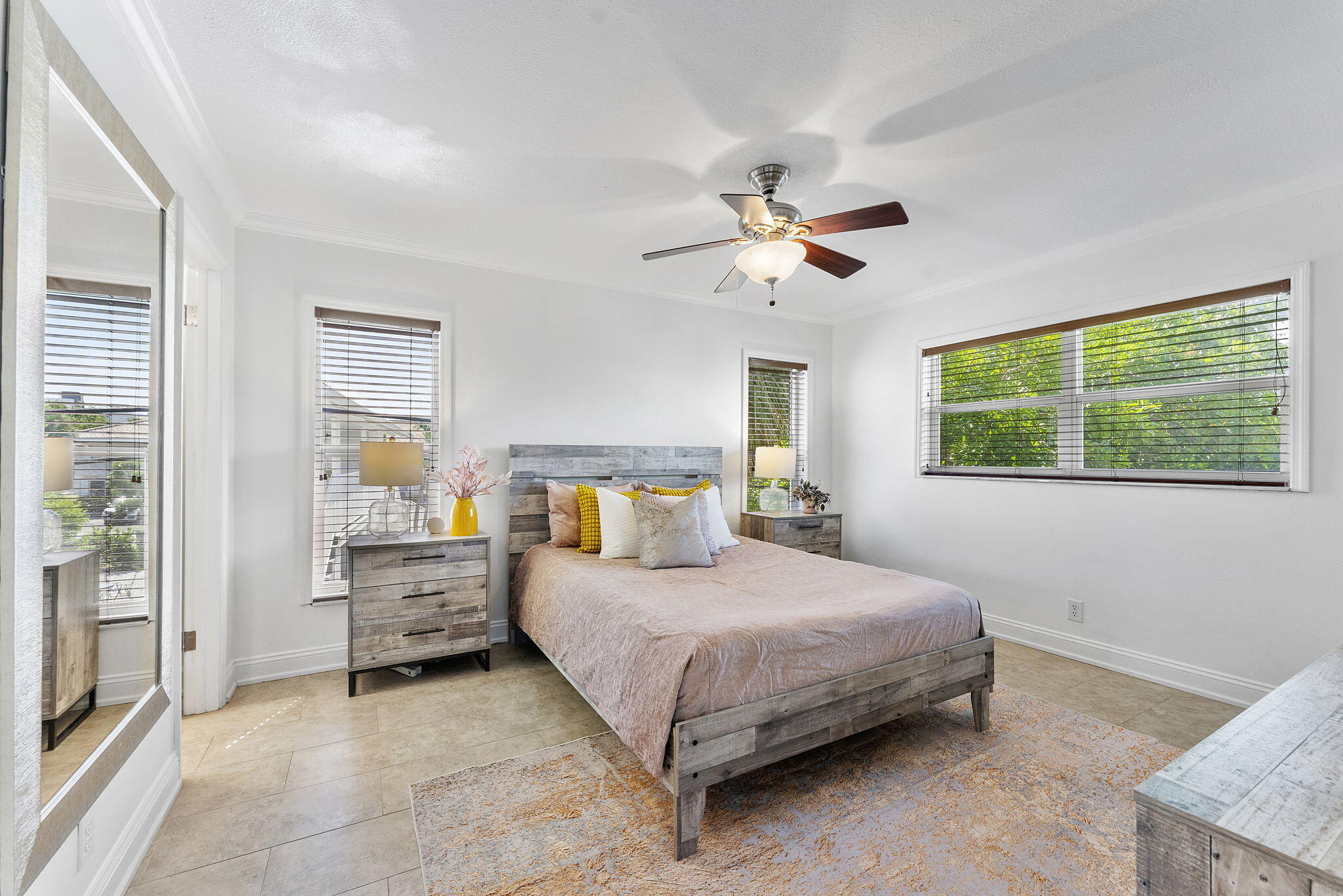 3200 Northeast 10th Street, Unit 7 Pompano Beach, FL 33062 - Photo 27 of 27 a bedroom with a bed a couch and a window