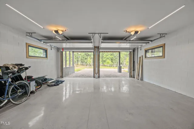 a view of a livingroom with furniture and a window