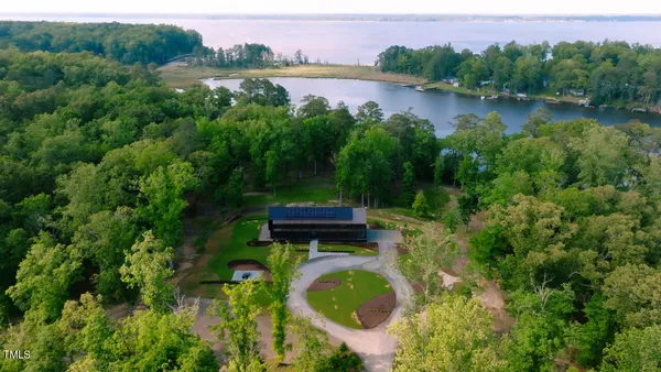 a backyard of a house with yard and lake view