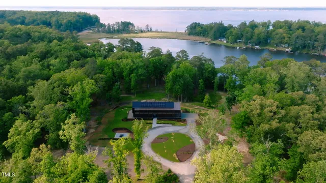 a backyard of a house with yard and lake view