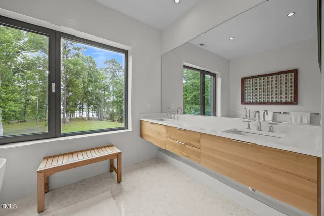 a bathroom with a sink and a large window