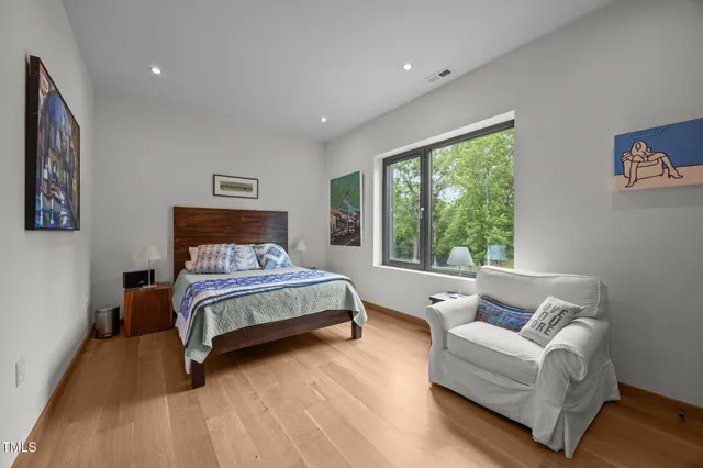 a bedroom with a bed and a couch