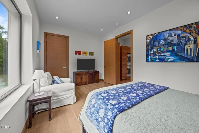 a bedroom with a bed and a couch