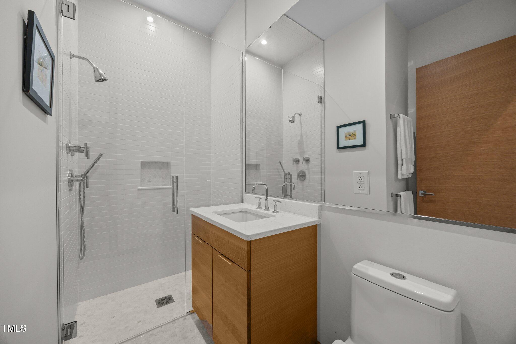 4725 Creeks Junction Road Blounts Creek, NC 27814 - Photo 36 of 42 a bathroom with a sink a toilet and shower